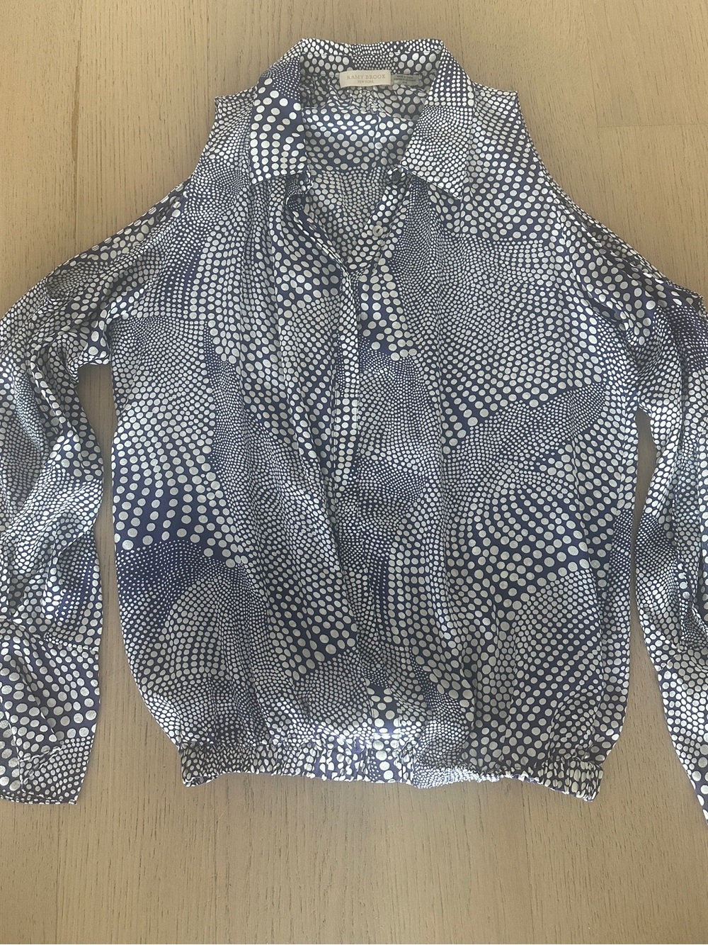 Ramy Brook 100%Silk Navy & White Polka Dot 4 Button Blouse with elastic waist.